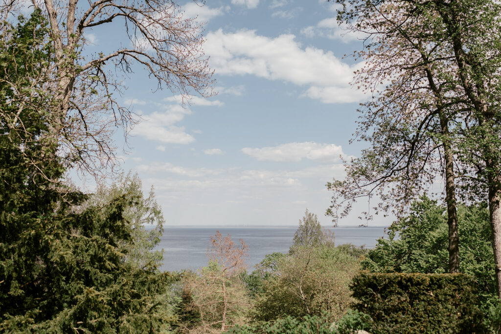 Wedding at Norrvikens trädgårdar 61 View of the sea from the gardens, trees framing the water