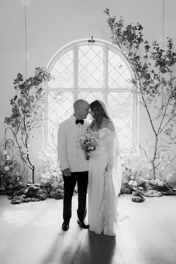 Wedding at Jordberga: a photographer's guide 6 Couple by a tall leaded window, black and white