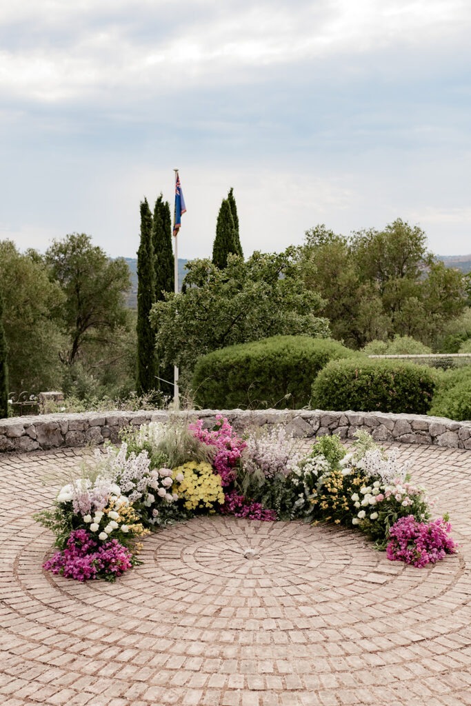 Ceremony terrace with flowers and cypresses at Millstone Villa, Kefalonia