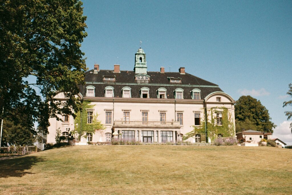 Maryhill Estate: the Hill House castle building seen across the lawn on a sunny day, shot on 35mm film