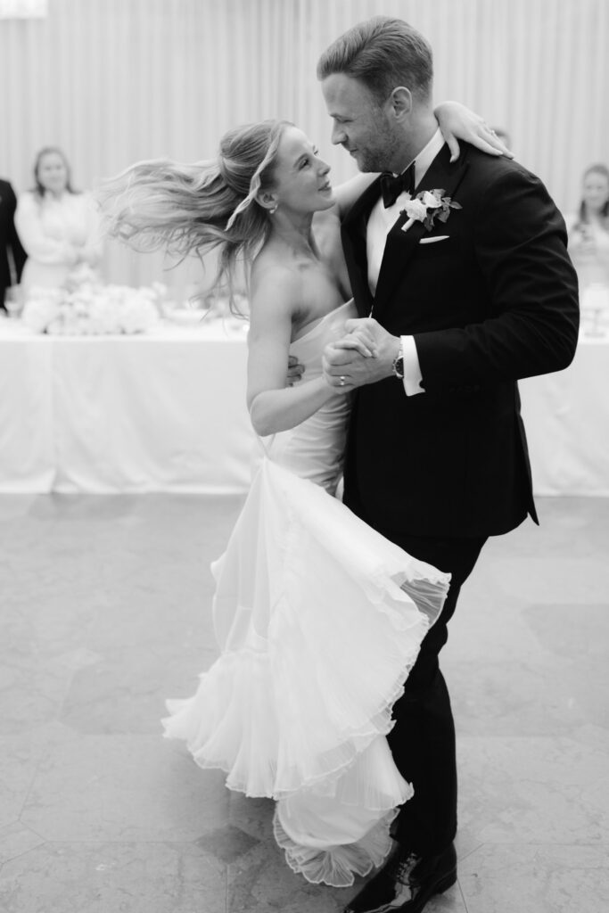 Wedding at Norrvikens trädgårdar 15 Black and white: the couple dancing and smiling at each other